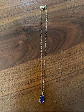Judith Bright four stone gold necklace with Lapis stones.